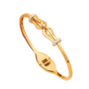 Bracelet jonc doré pour femme avec motif nœud central et détails brillants décoratifs, design élégant et féminin.