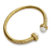 Bracelet jonc ouvert doré pour femme avec deux perles blanches décoratives aux extrémités et détails brillants incrustés sur le contour du bijou.