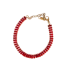 Bracelet femme doré serti de pierres rouges rectangulaires alignées avec fermoir ajustable et finition élégante.