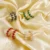 Boucles d’oreilles créoles pour femme avec pierres carrées colorées bleu, vert, rouge et transparent sur monture dorée élégante.