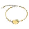 Bracelet doré pour femme avec pendentif Hello Kitty, chaîne ajustable et présentation dans un coffret cadeau élégant.