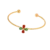 Bracelet jonc doré pour femme avec finition texturée et motif fleur composé de détails rouges et verts, élégant et raffiné.