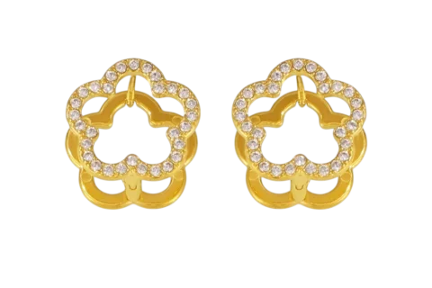 Boucles d'oreilles réversibles dorées en forme de fleur avec contour serti de petites pierres décoratives, portées à l'oreille.